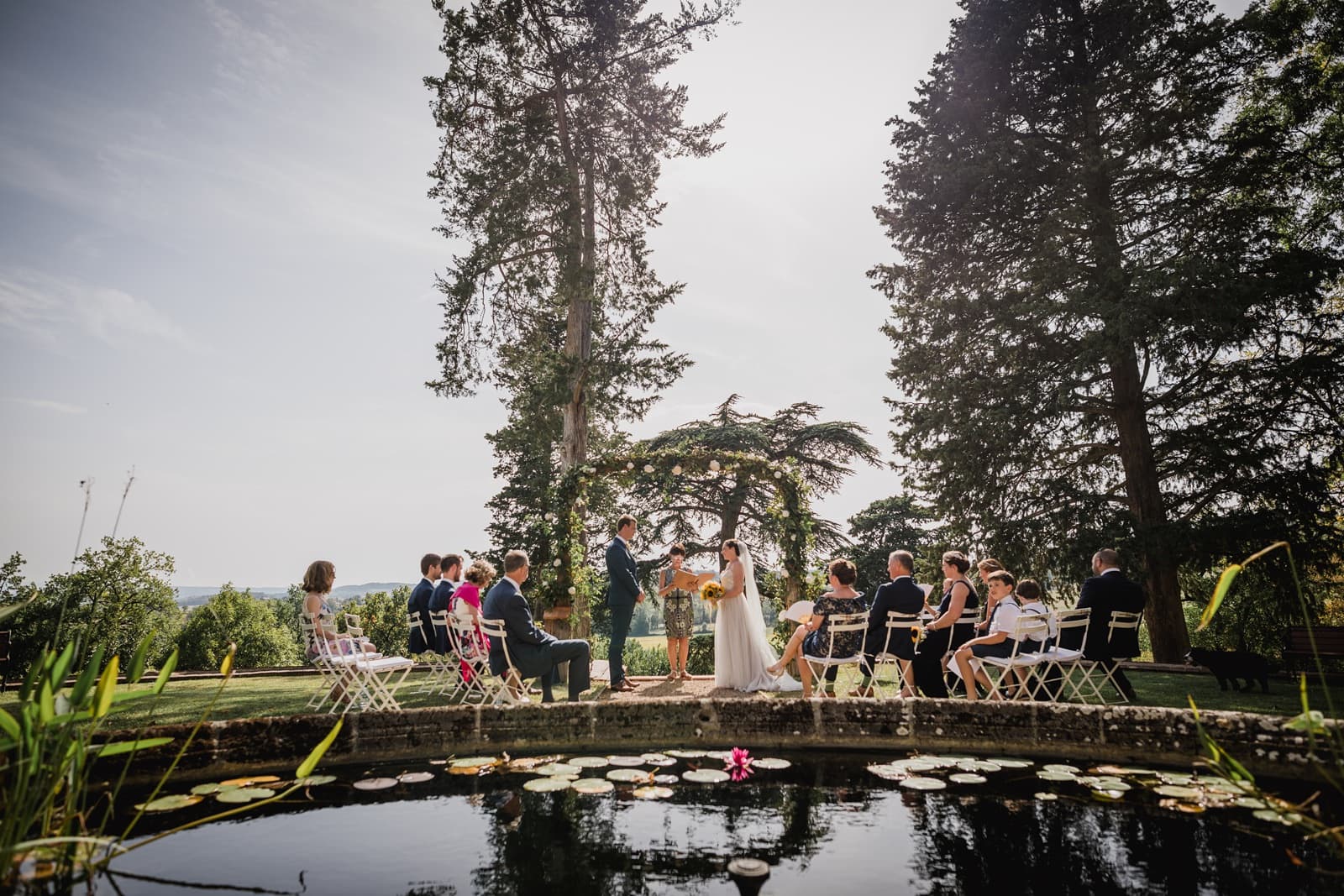 A wedding ceremony in the grounds of Chateau de Brametourte in France