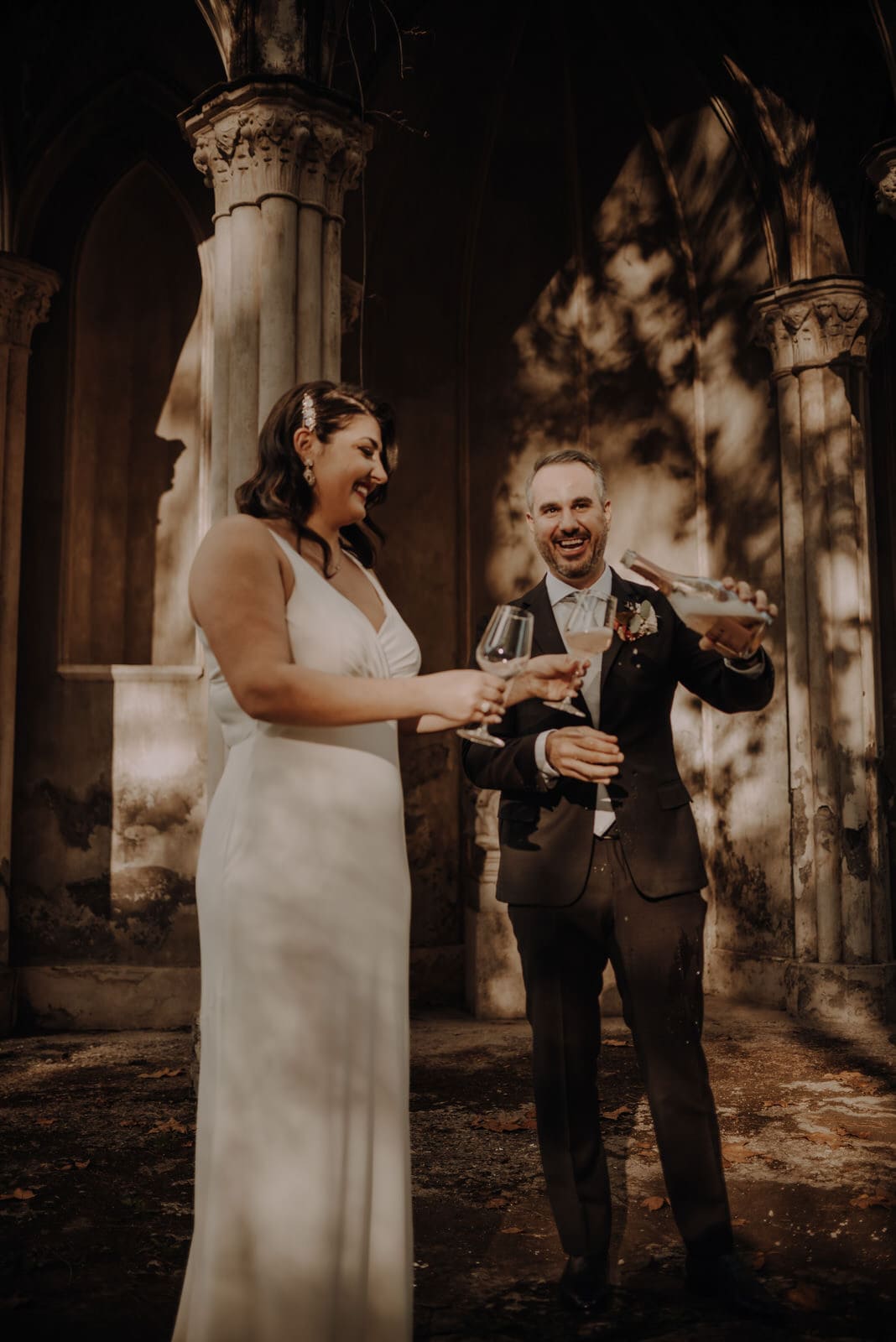 a Bride and groom toast with champagne after their wedding in Rome