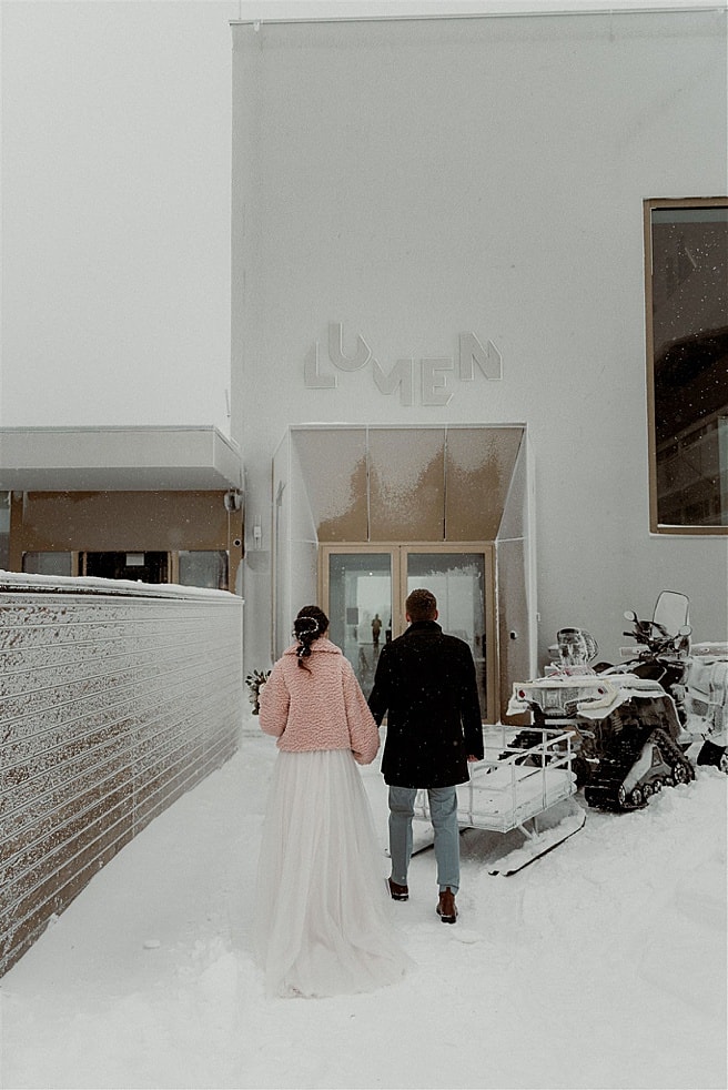 bride and groom enter the Lumen Museum for their ceremony